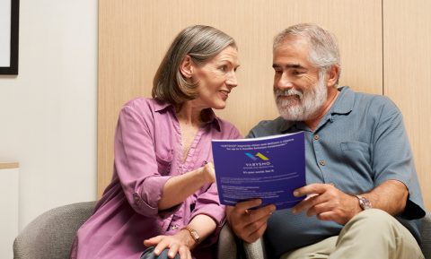 Patient and care partner in doctor's office waiting room
